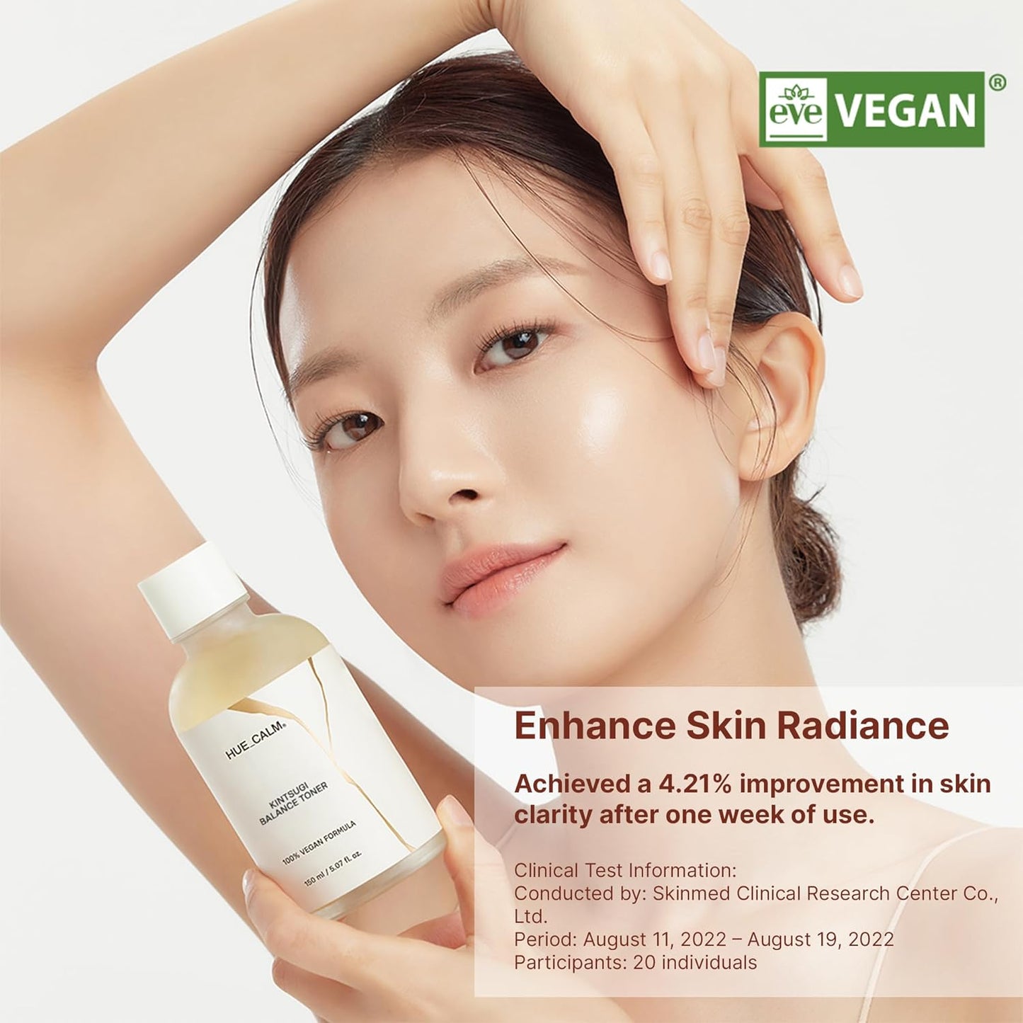 Huecalm Kintsugi Balance Toner held by model – vegan skincare promotion