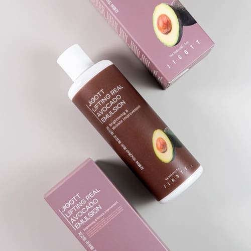 Top view of JIGOTT emulsion bottle surrounded by matching boxes for retail presentation