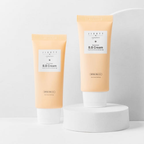 Two sizes of Jigott BB Cream Sunscreen displayed on white pedestal