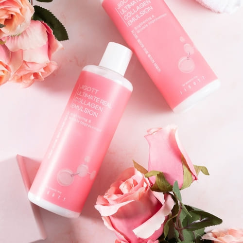 Two collagen emulsion bottles styled with soft pink roses and pastel tone