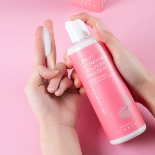 Model applying collagen emulsion to fingers showing creamy texture