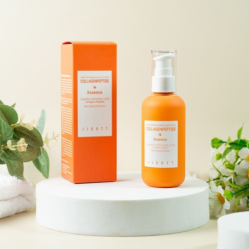 Minimalist studio shot of Jigott Collagen Peptide Essence and box on white pedestal