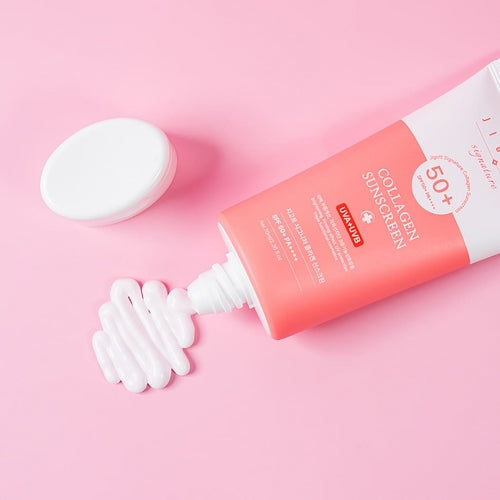 Jigott Collagen Sunscreen tube open with visible white cream texture on pink