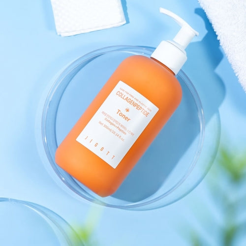 Jigott Collagenpeptide Toner on blue background flatlay with towel for wholesale