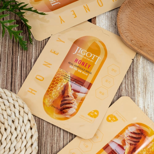 Honey masks arranged at angles on rustic wood with spa-themed props