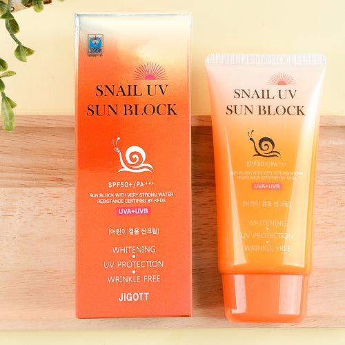 Jigott Snail UV Sunscreen upright next to branded box with gradient design