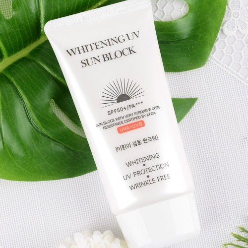 Jigott Whitening UV Sunscreen laid on green leaf with white net background