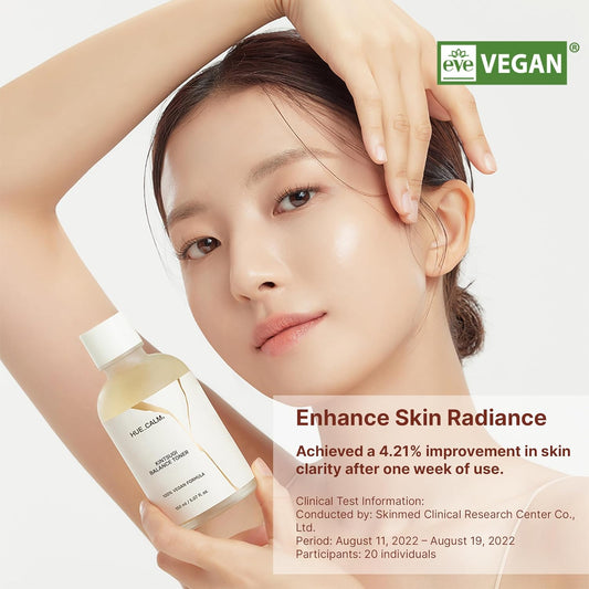 Huecalm Kintsugi Balance Toner held by model – vegan skincare promotion