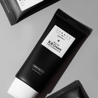 Close-up of Jigott All-in-One BB Cream black tube at an angle
