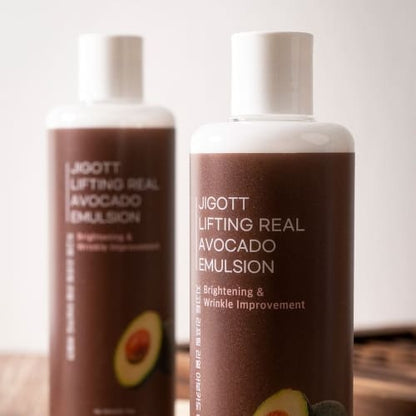 Close-up of two JIGOTT emulsion bottles with soft lighting on wooden table