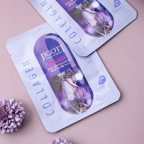 Jigott Collagen Real Ampoule Mask flatlay with purple flower, Korean skincare sheet mask