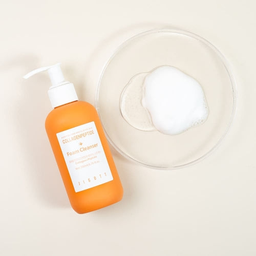 Jigott Collagenpeptide Foam Cleanser with foam texture shown in dish for K-Beauty