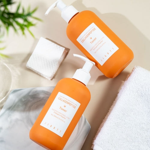 Jigott Collagenpeptide Toner bottles side by side on marble surface for wholesale