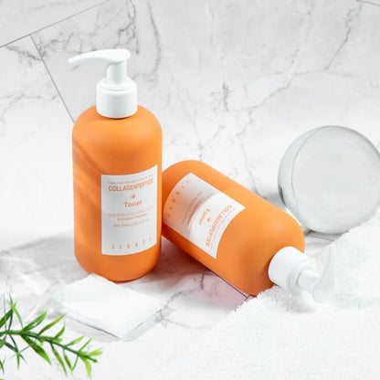 Jigott Collagenpeptide Toner with modern props on marble background