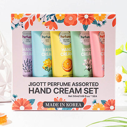 Boxed set of 5 JIGOTT Perfume Hand Creams displayed with floral decoration