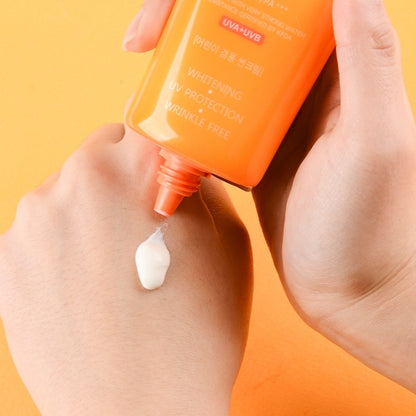 Jigott Snail UV Sunscreen being applied to back of hand showing white cream texture