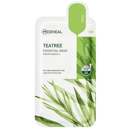 Mediheal Tea Tree Essential Mask placed in natural setting with green tea leaves and wood